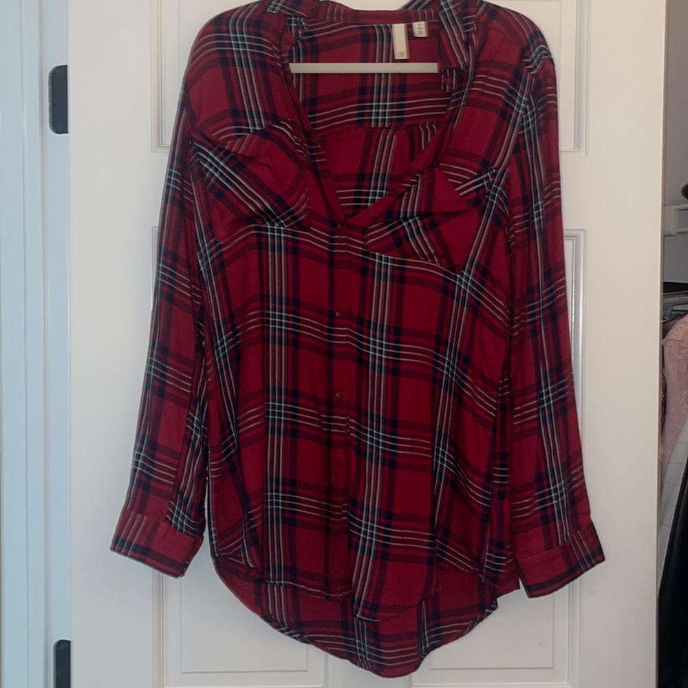 Plaid button down shirt.